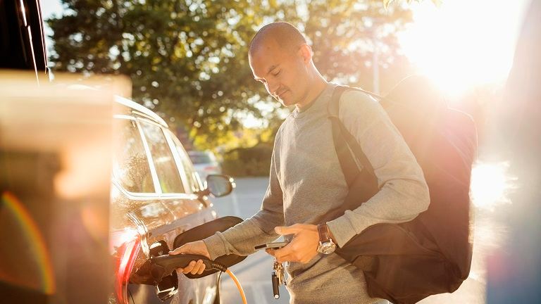 A man charging fuel to his car